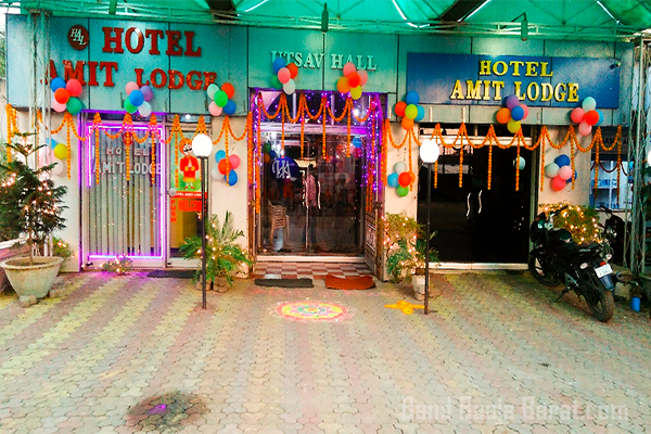 hotel amit lodge contact number